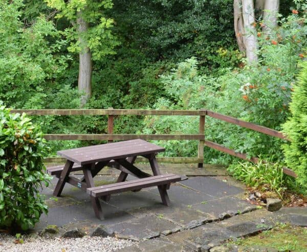 Recycled plastic picnic table that maintains the look of timber but without the maintenance