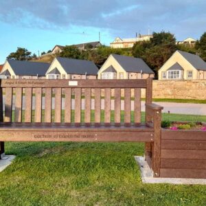 Front view form TDP Dale bench with engraving and plaque at Dolphin View Portmahomack overlooking Dornoch Firth