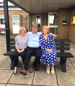 Enid and friends sitting on Brian Davies TDP Dale memorial bench made from recycled plastic at Pentrych RFC