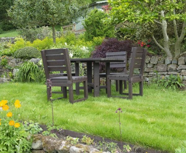 Outdoor Cromford Hope dinning set in Brown on a lawn made from Recycled Plastic waste by TDP