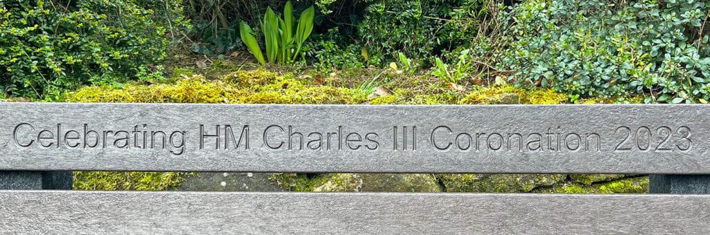 King Charles Coronation engraving close up on a TDP Peak bench