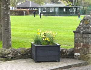 TDP Recycled Plastic Ipstone planter in Melrose, Scottish Boarders outside a park
