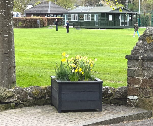 TDP Recycled Plastic Ipstone planter in Melrose, Scottish Boarders outside a park