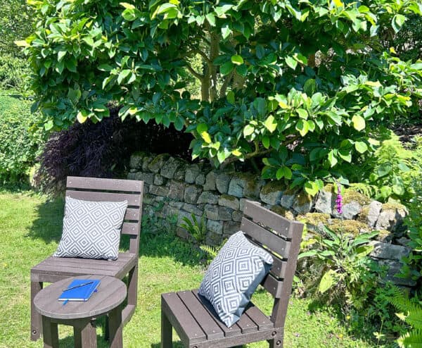 Cromford Chairs with a Hopton table in Brown with geometric style cushions
