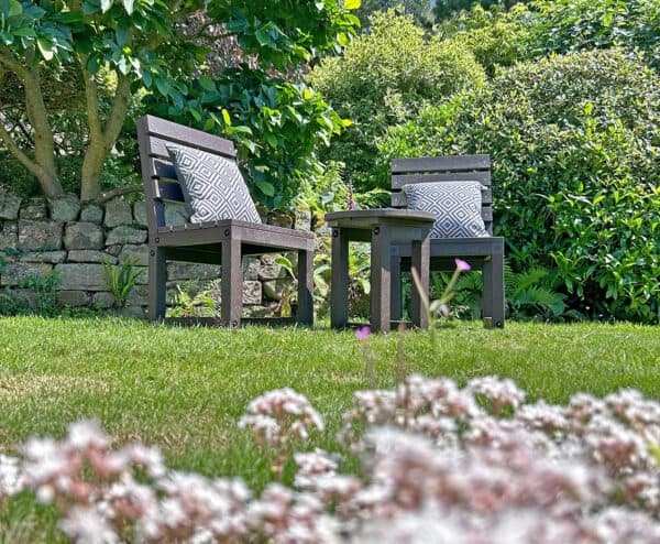 Cromford Chairs with a Hopton table in Brown with geometric style cushions 2