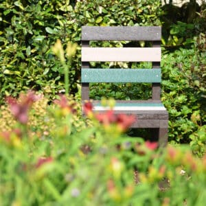Cromford garden chair in earth colours hiding in the bushes