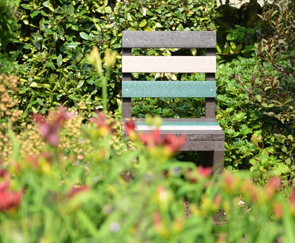 Cromford garden chair in earth colours hiding in the bushes