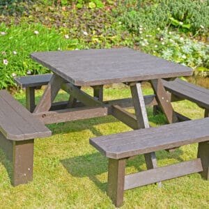 TDP Bradbourne 8 seater picnic table in brown in a garden setting 2