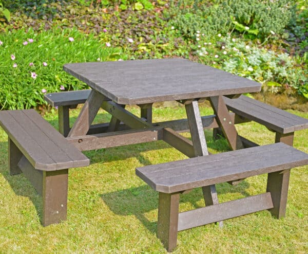 TDP Bradbourne 8 seater picnic table in brown in a garden setting 2