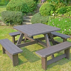 TDP Bradbourne 8 seater picnic table in brown in a garden setting