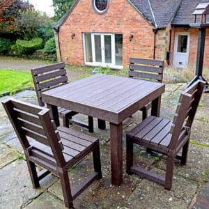 Middleton table with four Cromford Chairs in Brown on a patio