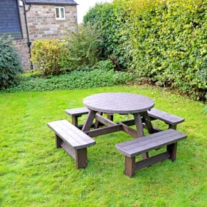 Eight seater Junior Hummingbird picnic table byt TDP - with a house in the background
