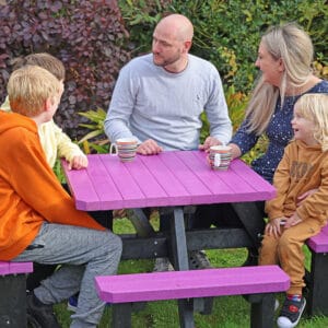 Eight seater Junior Picnic Table - The Parrot by TDP shown here in Purple with a family gathering