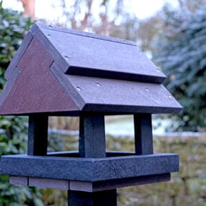 Bird Feeding Station In Brown - close up photo with a winter background